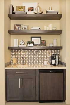 a kitchen with open shelving and coffee maker