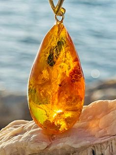 Pendant material and details : * Natural Baltic amber  * Type of Amber : Transparent  * Color of Amber : Honey *  * Metal : 24K gold-plated Sterling silver 925 * Size of pendant : 6,5 * 2,2 * 1,3 cm 🔻P.S  : Amber is not heated , melted or treated Luxury Elegant Amber Crystal Necklaces, Amber Pendant, Natural Amber, Baltic Amber, Gold Plated Sterling Silver, P S, Sterling Silber, Pendant Necklaces, Silver 925