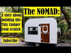 the nomad trailer is parked in front of some trees