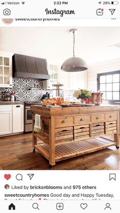 a kitchen island made out of wooden pallets in the middle of a wood floor