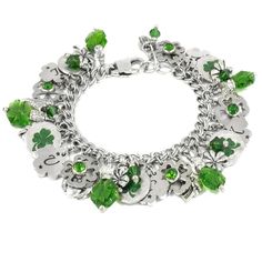 "Have good luck all day with your own Lucky Shamrock Irish Bracelet with 4 Leaf Clovers.  Surrounded with Sparkling Crystals in emerald green in the shape of shamrocks.  Lots of Irish charms, Leprechauns, pot of gold and 8 Irish charms give your bracelet a touch of Celtic magic.  Handcrafted in stainless steel with sterling silver settings, no plated materials, with vivid color, whimsical details and eye catching designs * Stainless Steel  * 5 Enameled 4 Leaf Clover Charms * 8 Irish Charms, Lepr Shamrock Bracelet, Fairytale Bracelet, Shamrock Jewelry, Celtic Bracelet, Lucky Charm Bracelet, Lucky Jewelry, Green Shamrock, Irish Jewelry, Clover Charm