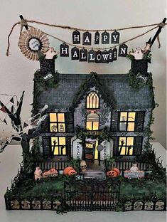 a house decorated for halloween with pumpkins and decorations