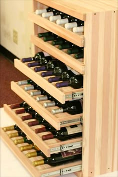 a wooden wine rack filled with lots of bottles