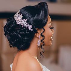 a woman in a wedding dress with a tiara on her head looking off to the side