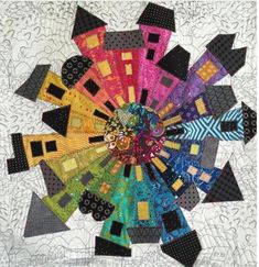 a colorful quilt with lots of different colors on it