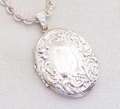 This is a vintage 31 Inch locket necklace. Branded 1928 Condition Has some tarnish on the chain. Locket works well. Pictures The pictures in the listing are of the item you will receive.  Shipping We ship USPS first class within 1 business day of purchase. The items are packaged in a jewelry box unless they are too big.  Best Offer I'm always open to your best offer! Thank you!  Vintage Victorian Locket Necklace by Avon 24 Inch - A1 Abstract Necklace, Locket Necklace Vintage, Victorian Locket, Silver Locket Necklace, Gold Locket Necklace, Art Nouveau Necklaces, Picture Locket, Sterling Silver Locket, Photo Locket Necklace