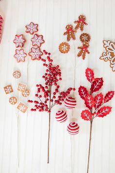 christmas cookies and candy decorations are arranged on sticks