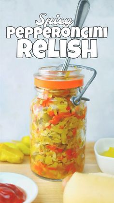 a jar filled with pickles and peppers on top of a wooden table next to other ingredients