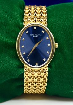 Brand: Patek Philippe Movement: hand-winding Case Material: 18K Yellow Gold Case Size: 30*35 mm Thickness: 6 mm Bracelet: 18K Yellow Gold Wrist size: Approximately 7.5 inch Dial: Blue color with Gold color hands and Hour Marks-Diamonds  Weight of the watch: 95.2 GM   Additional services such as refinishing and appraisal will be at extra cost ! We guarantee that all of our items are 100% authentic ! For additional photos and any inquiries, please send us a Direct Message ! We are official wholesalers, who have been selling for more than 2 decades ! Eligible for Paypal Credit & Affirm, If you're interested, please check if you qualify. For any questions, please feel free to send us a message. Luxury Diamond Hallmarked Watch, Luxury Gold Oval Watch, Luxury Oval Gold Watches, Formal Yellow Gold Diamond Watch Hallmarked, Luxury Anniversary Watch, Luxury Hallmarked Diamond Watch For Anniversary, Oval Diamond Watch For Formal Occasions, Luxury Oval Jewelry With Diamond Hour Markers, Formal Oval Diamond Watch