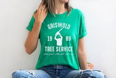 Griswold Tree Service Bella Canvas Shirt Perfect for any Christmas Vacation fan!  Looks great! Little full! Lotta sap!  This classic unisex jersey short sleeve tee fits like a well-loved favorite. Soft cotton and quality print make users fall in love with it over and over again. These t-shirts have-ribbed knit collars to bolster shaping. The shoulders have taping for better fit over time. Dual side seams hold the garment's shape for longer. .: 100% Airlume combed and ringspun cotton (fiber conte Christmas With The Kranks Movie, Christmas With The Kranks, Griswold Family, Cousin Eddie, Funny Matching, National Lampoons Christmas, National Lampoons Christmas Vacation, Lampoon's Christmas Vacation, National Lampoons