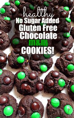 chocolate cookies with green candies are arranged on a white platter that says healthy no sugar added gluten free chocolate oreo cookies