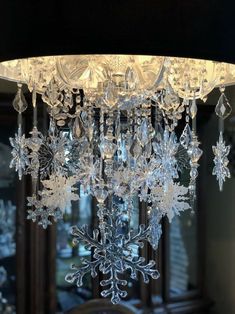 a chandelier with snowflakes hanging from it