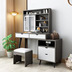 a white and black desk with drawers, a stool and a mirror