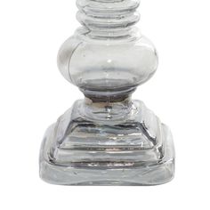 a clear glass candle holder on a white background