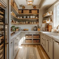 a kitchen filled with lots of open shelves