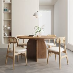 a dining table with four chairs around it