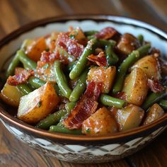 a bowl filled with green beans and bacon