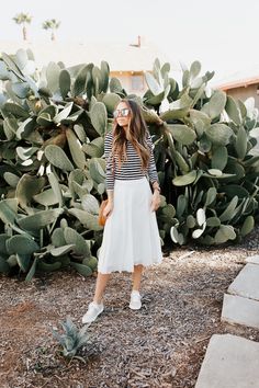 how to wear sneakers with a midi skirt Midi Skirt With Sneakers, Midi Skirt And Sneakers, White Midi Skirt Outfit, Fashion Scarf Tying, Skirt With Sneakers, Leather Leggings Look, Basic Sneakers, Skirts With Sneakers, Corporate Casual