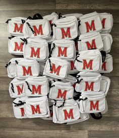 many bags with the letters m and m on them are arranged in a pyramid pattern