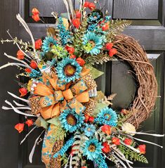 a wreath with orange and blue flowers on it