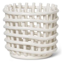 a white basket that is made out of plastic material and has multiple sections in it