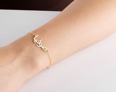 "This 14k solid gold Arabic name bracelet is a perfect birthday gift for a Muslim friend, mother, anniversary, birthday, new mom, bridesmaid, teenage girl, wedding, engagement, graduation, valentine's day, baby shower, bridal shower! Also, this real gold Arabic nameplate bracelet would make a great gift for bride, grandma, girlfriend, best friend, daughter or a treat for you! This personalised Islamic name jewellery has been produced with high quality 14k/8k solid gold or 925k solid silver and available in silver, gold, rose, white gold, yellow gold and rose gold colour.  FEATURES: * Custom Arabic name bracelet * chain in different lengths * great for daily wear * hypoallergenic * nickel-free, lead-free & cadmium-free * handmade in the UK * arrives in gift box * can include your gift messa Engraved Name Bracelet For Mother's Day Anniversary, Engraved Name Bracelet For Anniversary And Mother's Day, Engraved Name Bracelet For Anniversary Mother's Day, Engraved Name Bracelet For Anniversary, Mother's Day Gift, Yellow Gold Custom Name Bracelet For Mother's Day, Custom Name Yellow Gold Bracelet For Mother's Day, Custom Name Bracelets For Anniversary On Valentine's Day, Yellow Gold Name Bracelets For Mother's Day, Dainty Yellow Gold Name Bracelet For Birthday