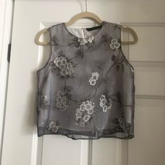 Zara Floral Embroidery Sheer Blouse. Color Is A Light Purple/Greyish With White Lining. Elegant Gray Summer Blouse, Elegant Floral Print Top For Festive Occasions, Elegant Sleeveless Gray Tops, Sleeveless Spring Festive Blouse, Elegant Summer Festive Embroidered Top, Elegant Embroidered Top For Spring Festivals, Elegant Sleeveless Tops With Intricate Embroidery, Elegant Sleeveless Top With Intricate Embroidery, Gray Party Tops For Spring