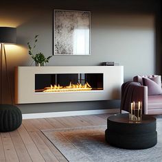 a living room with a fire place in the center and two candles on the floor