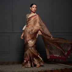 Indulge in the allure of our Pure Organza Saree, a limited edition creation with an enchanting print that captivates the senses. The saree is elevated by a gracefully crafted zari pallu and border, ensuring a blend of beauty and charm that is truly unmatched. Revel in the exquisite details of this exclusive piece. Slub Silk Saree With Sheer Dupatta, Transitional Slub Silk Saree With Sheer Dupatta, Festive Slub Silk Saree With Sheer Dupatta, Festive Saree With Sheer Dupatta In Slub Silk, Elegant Transitional Slub Silk Pre-draped Saree, Transitional Tussar Silk Blouse Piece With Sheer Dupatta, Elegant Pre-draped Saree With Printed Border For Designer Wear, Designer Tussar Silk Pre-draped Saree With Printed Border, Transitional Tussar Silk Saree With Sheer Dupatta