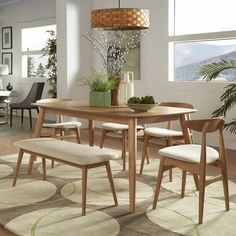 a dining room table with four chairs around it