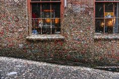 a building covered in lots of confetti next to a street