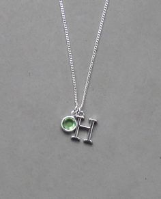 The initial is silver plated and measures 10 mm x 15 mm. It is strung on a silver plated tiny 1.3 mm curb chain with a lobster clasp closure. Choose the length from the drop down. To add a birthstone charm to this necklace, follow link below to purchase birthstone charm. https://www.etsy.com/listing/634099372/add-a-birthstone-charm?ga_search_query=add&ref=shop_items_search_1 Silver Charm Necklaces With Adjustable Chain For Birthday, Silver Charm Necklaces With Birthstone And Dangle Shape, Silver Charm Necklaces With Birthstone Dangle, Adjustable Silver Charm Necklace With Initials, Silver Teardrop Birthstone Charm Necklace, Personalized Green Sterling Silver Charm Necklaces, Personalized Green Sterling Silver Charm Necklace, Silver Everyday Charm Necklaces With May Birthstone, Green Sterling Silver Charm Necklace With Lobster Clasp