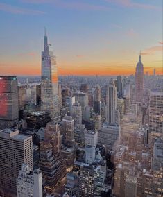 an aerial view of new york city at sunset