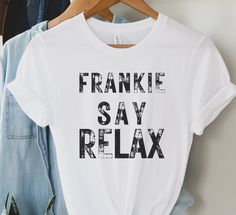 This cute Frankie Say Relax is a cute shirt inspired by Rachel. With distressed font, this shirt has the vintage vibe that's perfect for this shirt. Looks great on a variety of colors and is a great gift idea for anyone in your life. This unisex jersey short sleeve tee fits like a well-loved favorite. Soft cotton and quality print make users fall in love with it over and over again. These t-shirts have-ribbed knit collars to bolster shaping. The shoulders have taping for better fit over time.  D Distressed Font, Funny Tshirt, Cute Shirt, Vintage Vibe, Gift For Friend, Style Shirt, Popular Style, Cute Shirts, Jersey Shorts