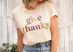 Celebrate the fall season with this give thank thankgiving shirt! Perfect to wear as thanksgiving family shirts. Our designs are printed on Bella + Canvas 3001 Unisex shirts, the #1 choice for tees. This great fitting tee will quickly become a go-to in your wardrobe! The airlume cotton is combed, ring-spun cotton that is flexible and lightweight - perfect for casual wear, or any activity. Please note the unisex sizing. It's important to check the included size chart to compare with a favorite te Friendsgiving Shirts, Thanksgiving Shirts For Women, Thanksgiving Mom, Thankful Shirt, Thanksgiving Family, Thanksgiving Shirt, Thanksgiving Shirts, Give Thanks, Unisex Shirts