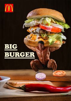 a man is balancing on a giant burger