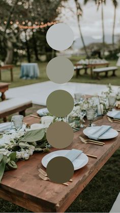 the table is set with plates and place settings for an outdoor dinner party or celebration