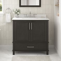 a bathroom with a sink, mirror and rug on the floor in front of it