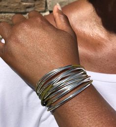 Wrap your wrist with style with this bold & beautiful leather cuff wrap bracelet that features multiple strands of leather cords accented with moveable tube beads that are secured together with a strong magnetic clasp.Every item is handcrafted by me and arrives in a lovely black kraft gift box; ready for gift giving or keeping for yourself!Watch Video: https://www.youtube.com/watch?v=JtI11KpEn2M> Multi Strands of 2mm leather cord> Silver-plated tube accents> Very strong magnetic cla Adjustable Wrap Bangle Bracelet, Adjustable Unique Wrap Bangle Bracelet, Unique Adjustable Wrap Bangle Bracelet, Spring Adjustable Bohemian Cuff Bracelet, Hand Wrapped Multi-strand Wrap Bracelet, Adjustable Multi-strand Bracelet, Hand Wrapped Metal Cuff Bracelet, Bohemian Style Stackable Wrap Bracelet, Adjustable Stackable Multi-strand Wrap Bracelet