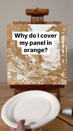 a person holding a white plate in front of an easel with the words why do i cover my panel in orange?