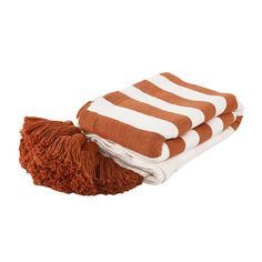 two brown and white towels stacked on top of each other