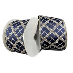 two rolls of blue and gold ribbon with white trim on each side, one roll is in