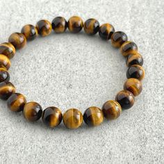 Grade A yellow tiger eye beaded bracelet for men Pouch Handmade, Slide Bracelet, Tiger Eye Bracelet, Tiger Eye Beads, Eye Beads, Gemstone Beaded Bracelets, Mens Beaded Bracelets, Beaded Stretch Bracelet, Stretch Bracelet