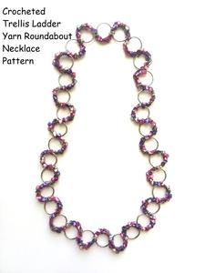 a necklace made out of purple glass beads