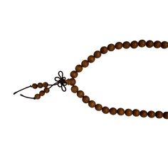 This is a long praying rosary chain with natural sandalwood small beads.  It uses a semi-elastic string and no opening knot. The wood has its natural dense wood grain pattern on the surface.   Dimensions: bead dia 0.25". 16" length Origin: China Material: Sandalwood Condition: good   For all USA domestic continental customers (from 48 states), there is a flat shipping fee of $15 which includes insurance and handling charges. Brown Wooden Beads Mala As Gift, Praying Rosary, Wooden Beads Rosary For Meditation, Holistic Brown Mala With Wooden Beads, Brown Hand Knotted Mala With Round Beads, Traditional Handmade Brown Rosary, Adjustable Brown Wooden Bead Rosary, Traditional Brown Rosary With Round Beads, Adjustable Brown Wooden Beads Rosary