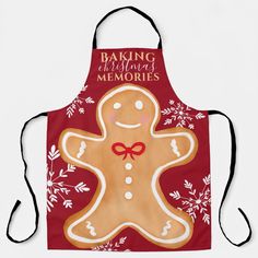 a red apron with a smiling ginger on it's front and the words baking for christmas memories