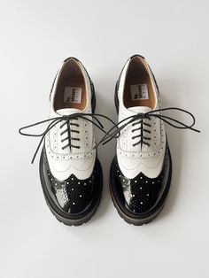 Black and white oxford shoe woman. Comfortable pad.  The rounded sock is complemented by decorative welt. Closed lacing and lots of perforations.  On the sock is a medallion. A beautiful addition to oxfords. Rubber sole Vibram (Italy) with tread that adds massive vapors. To see more shoe woman from our collection click: https://www.etsy.com/shop/TeShoes PRODUCT INFORMATION Colour: black & white Upper: toe - patent leather, genuine smooth leather Lining: leather Sole: EVA, polyurethane (Vibram) * Oxford Shoes Black And White, White Flat Heel Lace-up Office Shoes, Vintage Black Oxford Lace-up Shoes, White Lace-up Shoes With Brogue Detailing, Vintage Oxfords With Brogue Detailing And Flat Heel, White Lace-up Oxford Shoes, White Brogue Lace-up Shoes With Round Toe, Classic White Lace-up Office Shoes, White Lace-up Shoes For Office