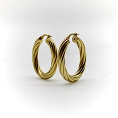 These 14k gold vintage hoops are a great pair of everyday earrings. The larger size of the hoops gives these earrings a great visual presence, while their hollow-construction allows them to remain lightweight. These make for a sophisticated staple piece in any collection--we’ve paired them with earring enhancers to show how these earrings can be used to create a variety of looks.   The ovals measure  1 3/8” x 1 1/16”, with a width of 4.62 mm. Combined, the earrings weigh 3.5 grams. They are marked on the earring stem with 14K, Italy, and a hallmark of a B within a circle.   The earrings are in very good condition. Because of their hollow nature, one of the earrings has two very small indentations. The indentations are hardly noticeable and do not detract from the earrings, but we wanted to Timeless Oval Hoop Earrings With Polished Finish, Oval 14k Gold Hoop Earrings Timeless Style, 14k Gold Oval Hoop Earrings Timeless Style, Luxury 14k Gold Oval Hoop Earrings, Timeless Oval 14k Gold Hoop Earrings, Timeless 14k Gold Oval Hoop Earrings, Classic Tarnish-resistant Oval Hoop Earrings, Elegant 14k Gold Oval Hoop Earrings, Timeless Oval Hoop Earrings As Gift