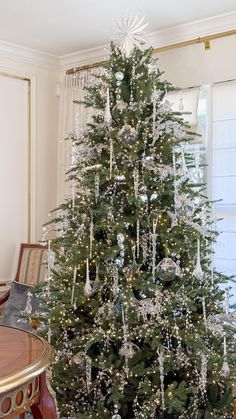 a decorated christmas tree in a living room