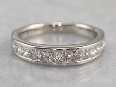 This vintage wedding band is set with a glittering row of square-cut, fine high-quality diamonds. The look they create is very 'Deco', and very modern at the same time! Channel settings never go out of style! The effect of one long row of diamonds, one band of glittering bright light, across the finger is always popular and always lovely. The sides of the ring completely encase the diamonds, keeping them safe and secure, which makes these rings easy to wear every day! Metal: Platinum Gem: 12 Dia Channel Set Diamond Ring, Channel Set Wedding Band, Channel Set Diamond Band, Vintage Wedding Band, Mom Jewelry, Square Diamond, Unique Wedding Bands, Wedding Band Sets, Anniversary Bands